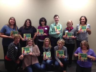 Directors from Child Advocacy Centers in Indiana holding donated copies of WHAT DO YOU WANT TO BE?